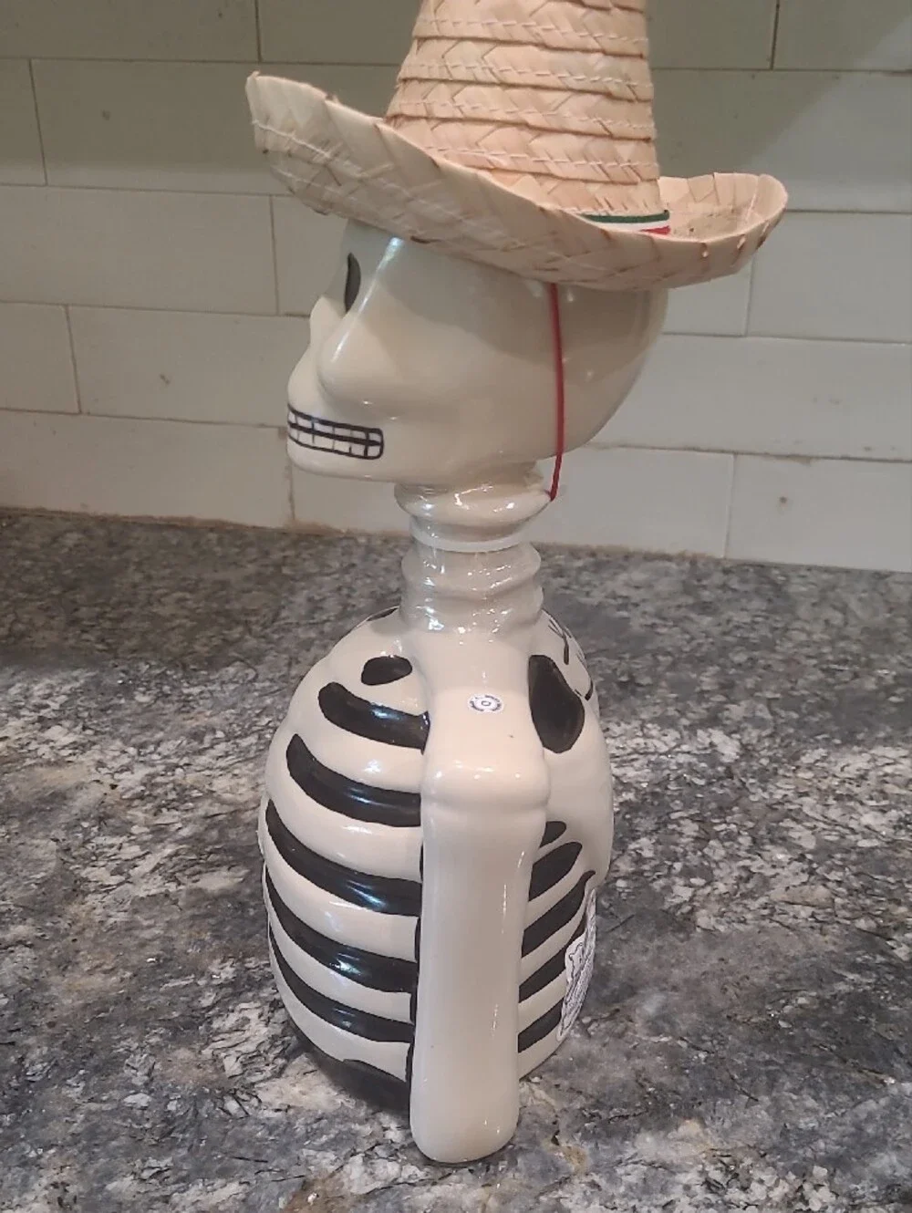 Ceramic Skeleton Bust Décor in White and Black with Straw Hat Accent